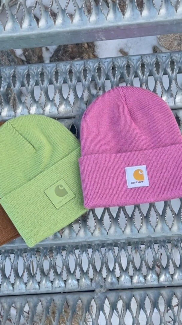 7 Gift Ideas on Amazon: Cozy, Techy and Easy to Wrap 1 Lime green and pink Carhartt knit cuffed beanies on a metal grate.