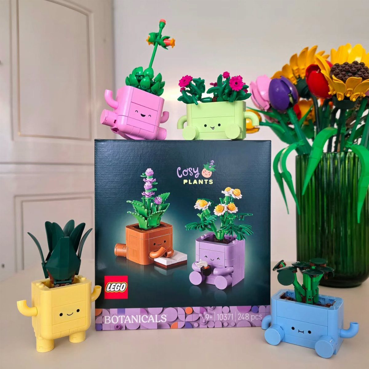 7 Gift Ideas on Amazon: Cozy, Techy and Easy to Wrap 6 LEGO Cosy Plants set with colorful brick-built smiling pots and original packaging box.