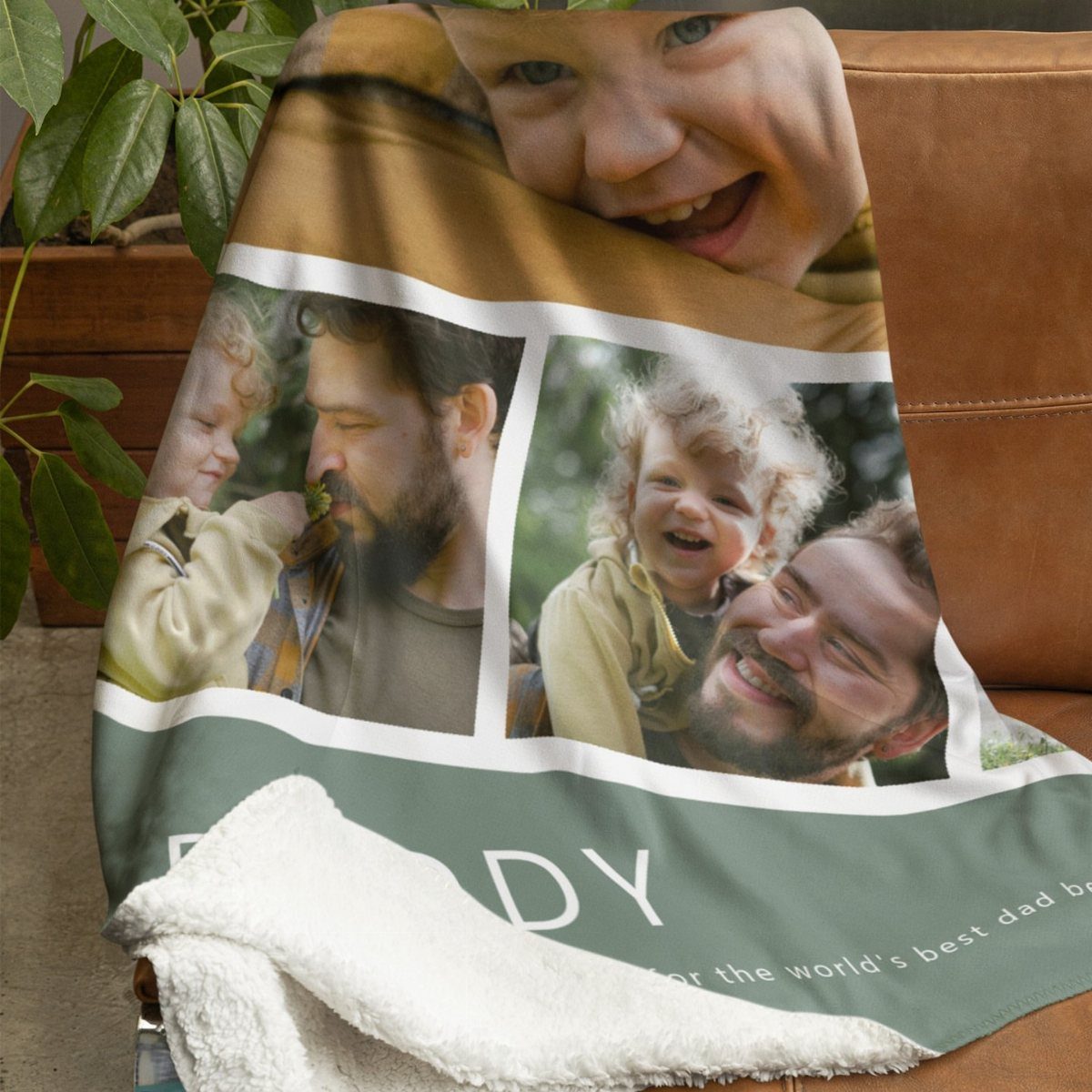 Personalized photo blanket with images of a father and child on a sofa