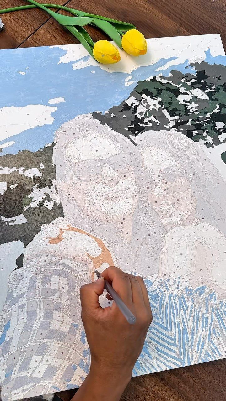 12 Good Gifts for Grandma She'll Actually Use and Treasure 12 Custom paint-by-number canvas of two women being painted with yellow tulips nearby.