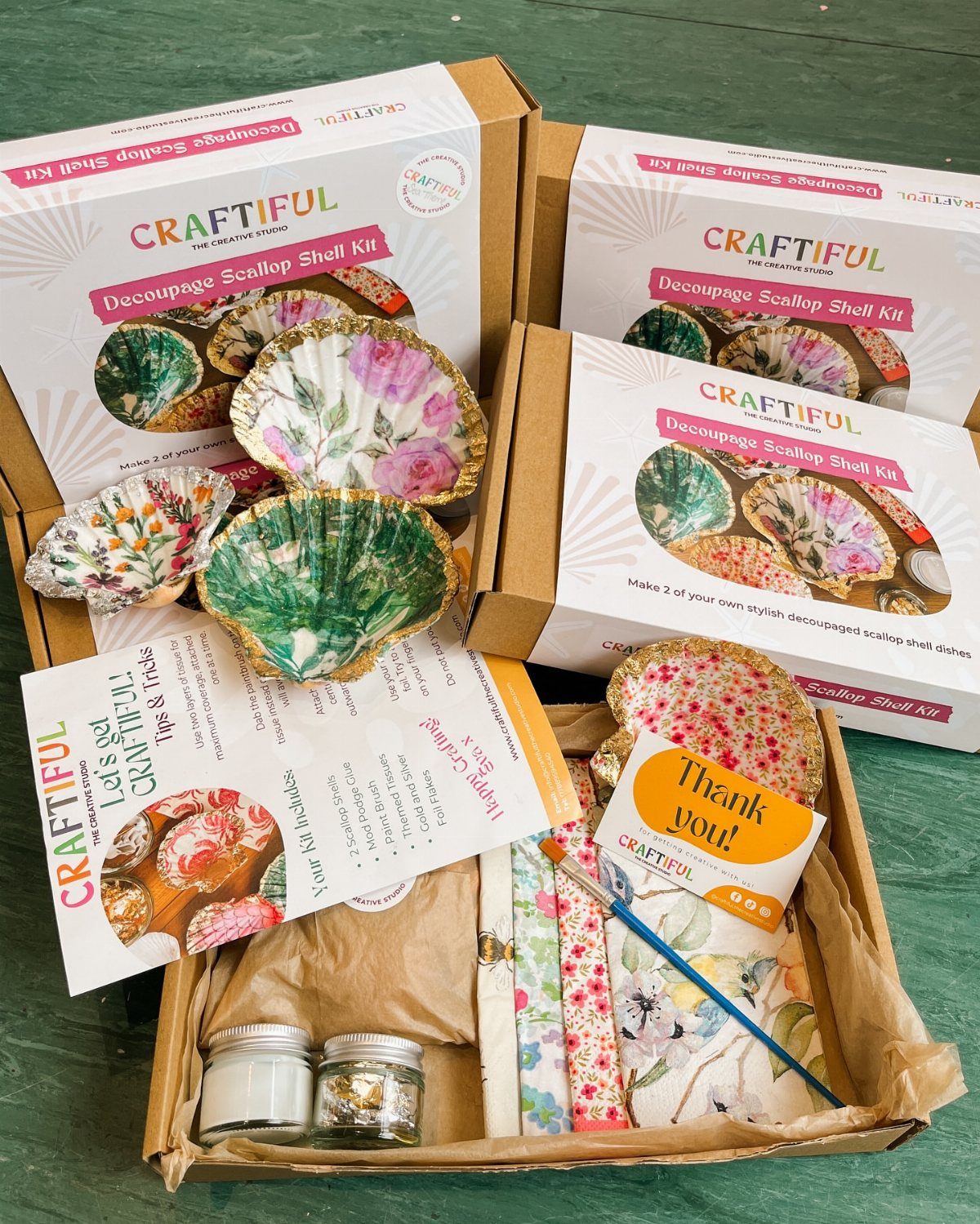 12 Good Gifts for Grandma She'll Actually Use and Treasure 11 Decoupage scallop shell craft kit with floral shells, brushes, and branded packaging.