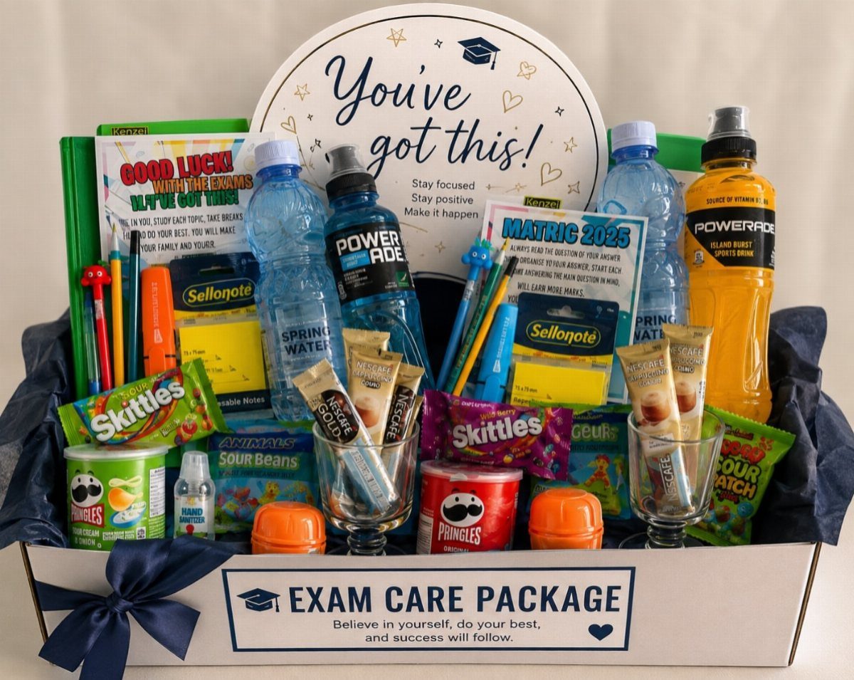 Exam care package box filled with snacks, drinks, and colorful school supplies.