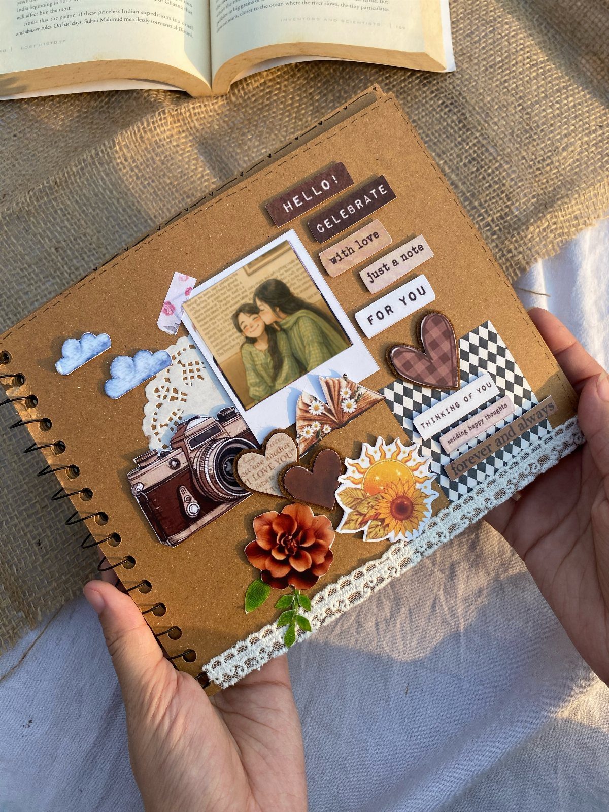Scrapbook journal page with a photo of friends, floral stickers, and heart decorations.