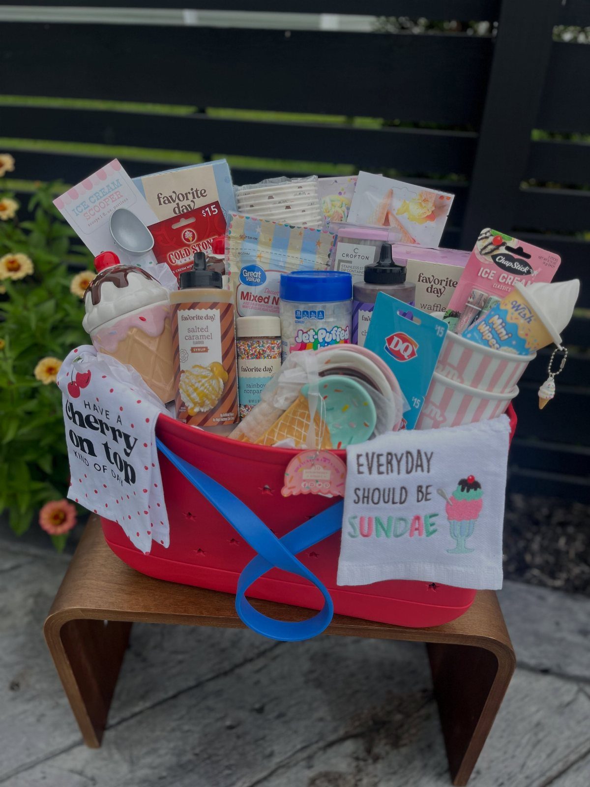 14 Household Gift Basket Ideas for Every Occasion 6 Ice cream sundae gift kit in a red tub with toppings and bowls