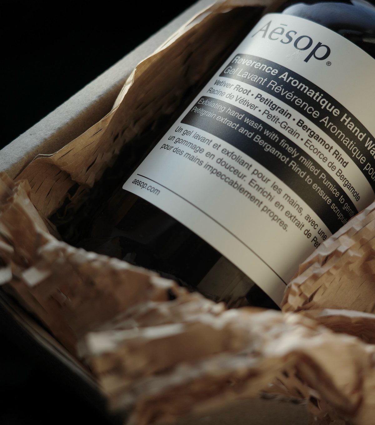 Aesop Reverence Aromatique Hand Wash bottle packed in brown paper inside a box