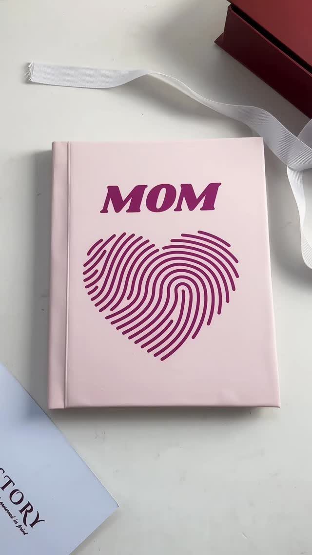Light pink photo album with purple MOM text and fingerprint heart design