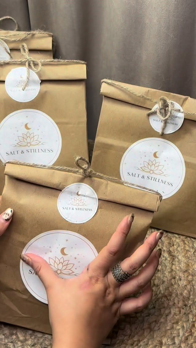 Brown paper bags with Salt and Stillness labels and twine ties.