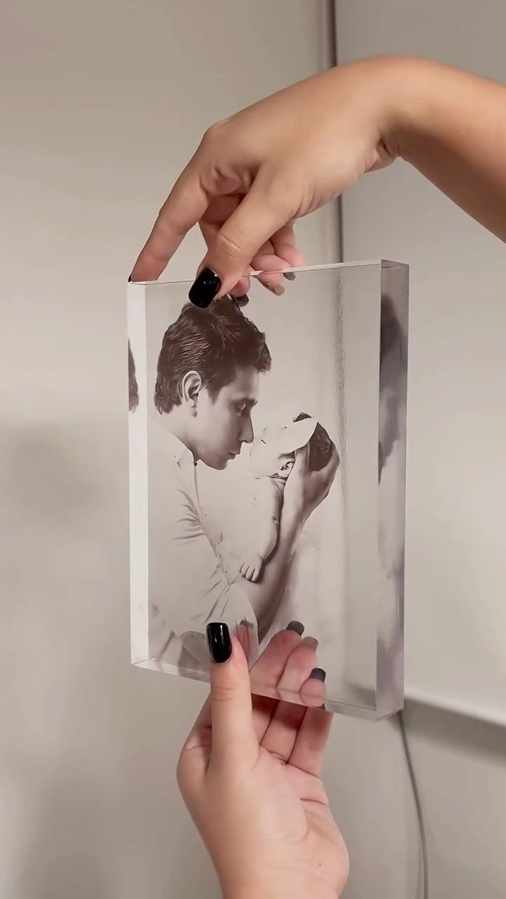 Photo Gifts for Dad From Daughter: 7 Ideas He'll Keep 5 Acrylic photo block showing a man holding a baby, held by two hands.