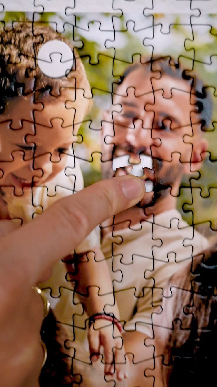 Photo Gifts for Dad From Daughter: 7 Ideas He'll Keep 4 Hand assembling a custom photo puzzle of a father and young child outdoors