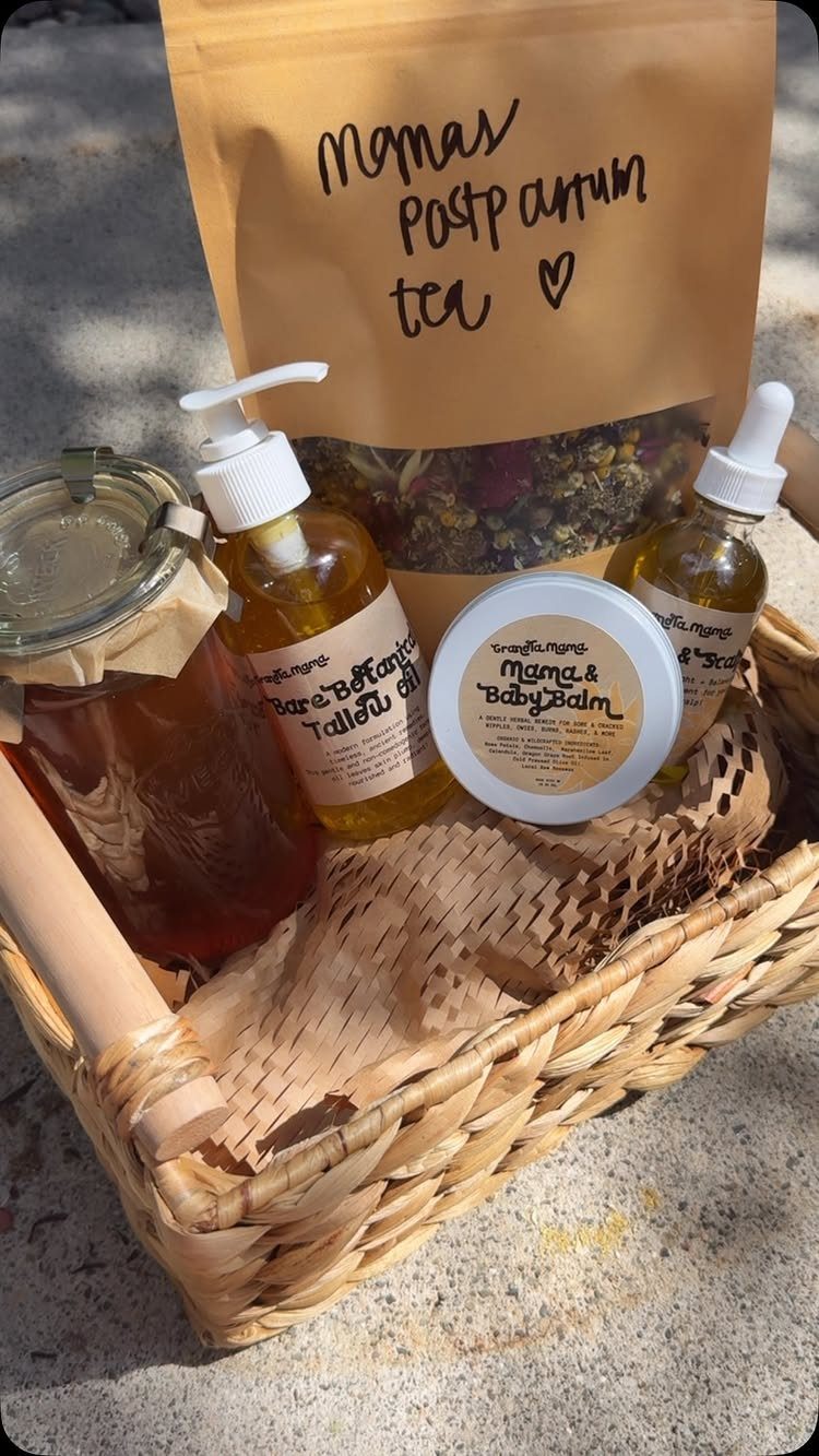 Postpartum Gift Basket Ideas for New Moms: 9 Picks 3 Woven gift basket with postpartum tea, baby balm, and various skincare oils.