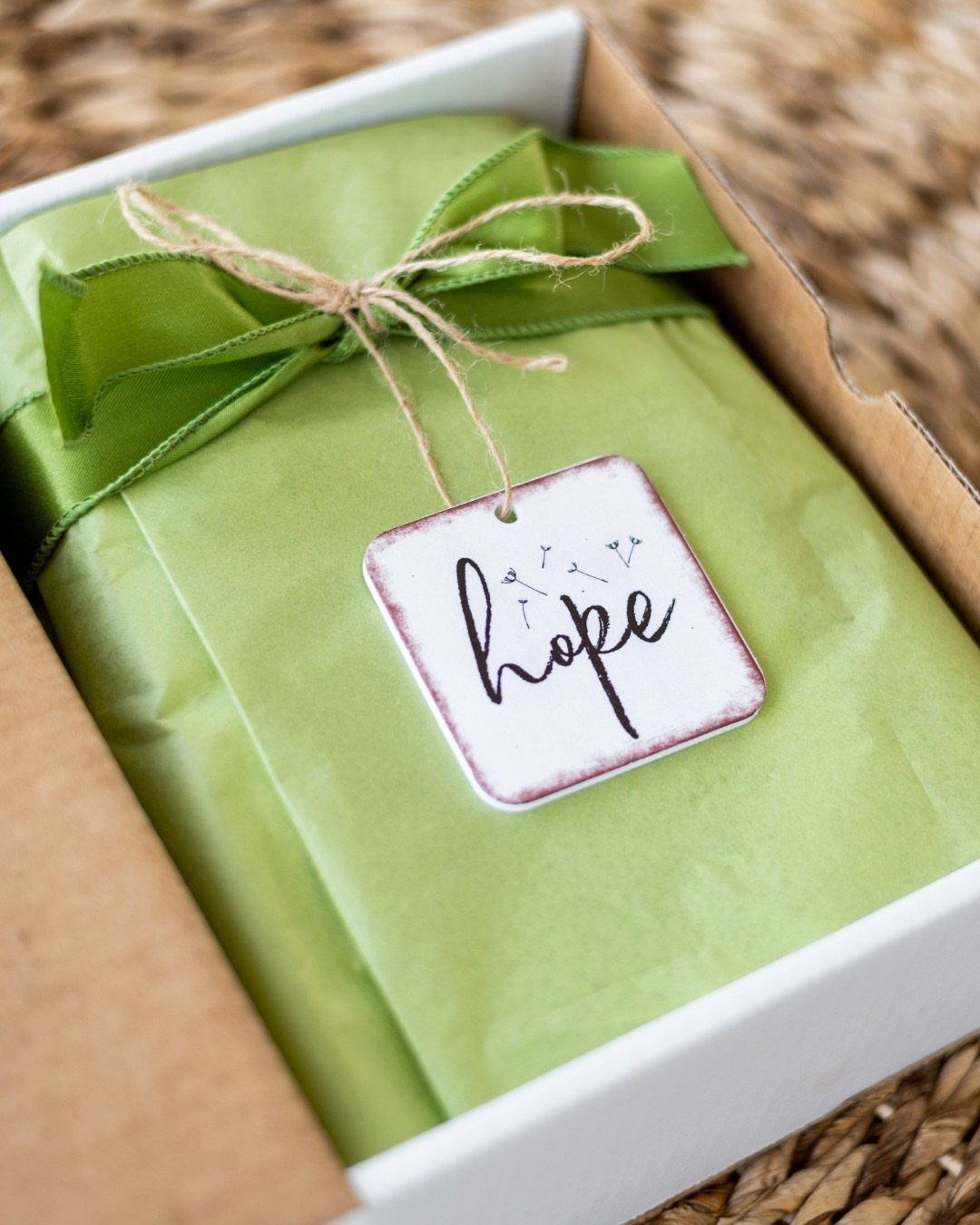 Self Care Gift Box Ideas for Any Occasion: 5 Picks 5 Green wrapped gift package in a white box with a tag saying hope