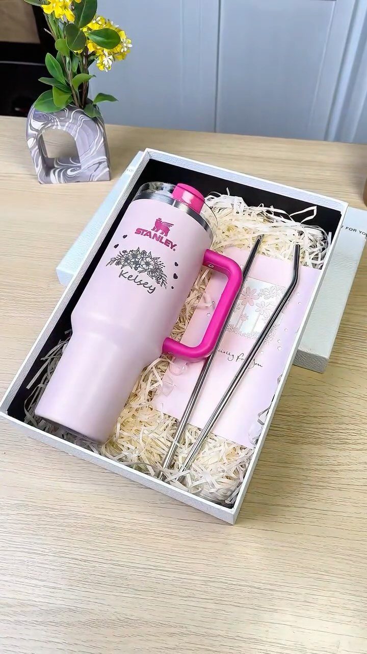 8 Small Gift for Mom Ideas, From Bath Soaks to Baskets 4 Pink personalized Stanley tumbler in a white gift box with metal straws