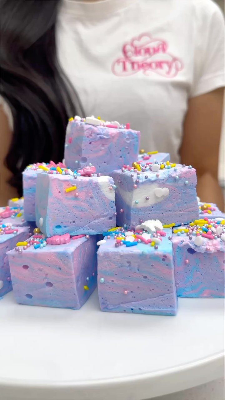 14 Small Unisex Gifts for Friends, Coworkers and Family 1 Marbled purple and blue gourmet marshmallows topped with colorful sprinkles on white surface.