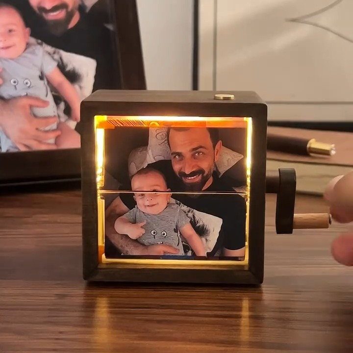10 Special Gifts for Dad: Personalized Picks He'll Keep 10 Wooden cube photo viewer showing a man and baby with a side crank.