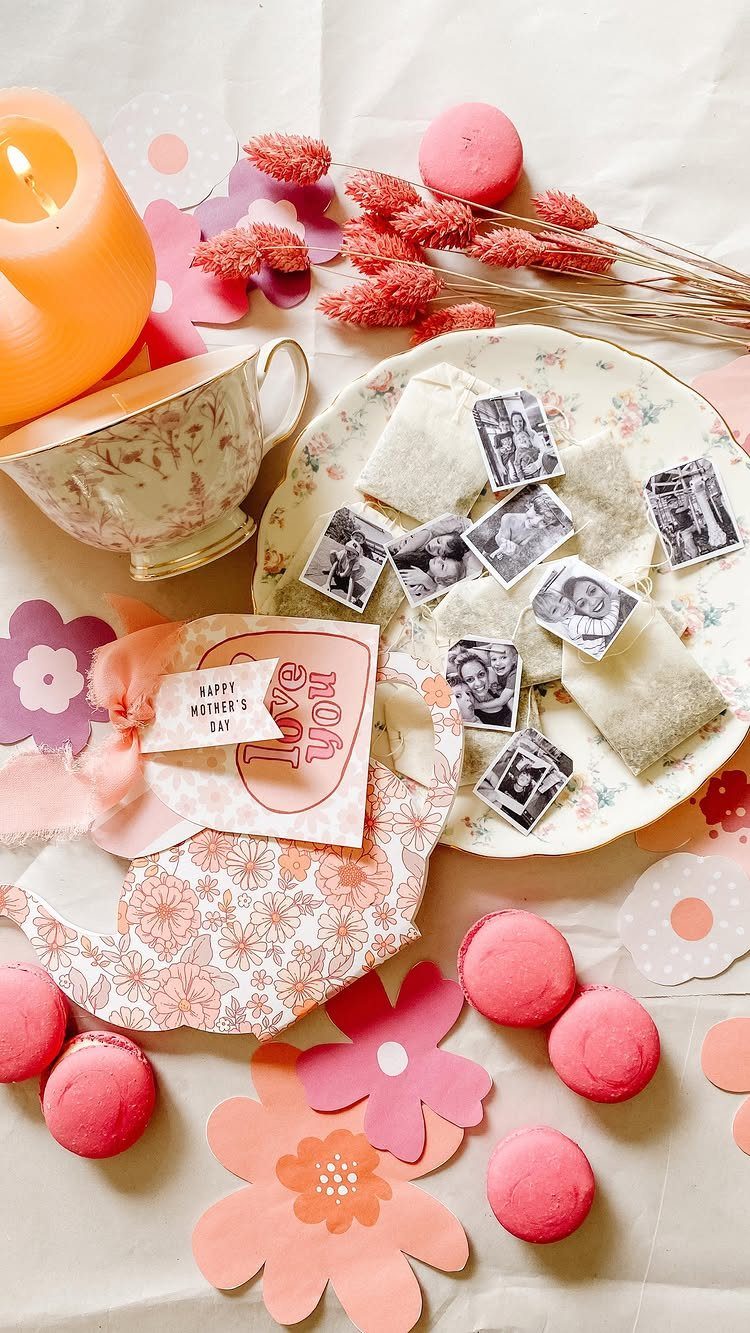 Tea Bag Gift Ideas to Make or Buy: 11 Sweet Picks 9 Tea bags with attached photos on a floral plate with macarons and flowers.
