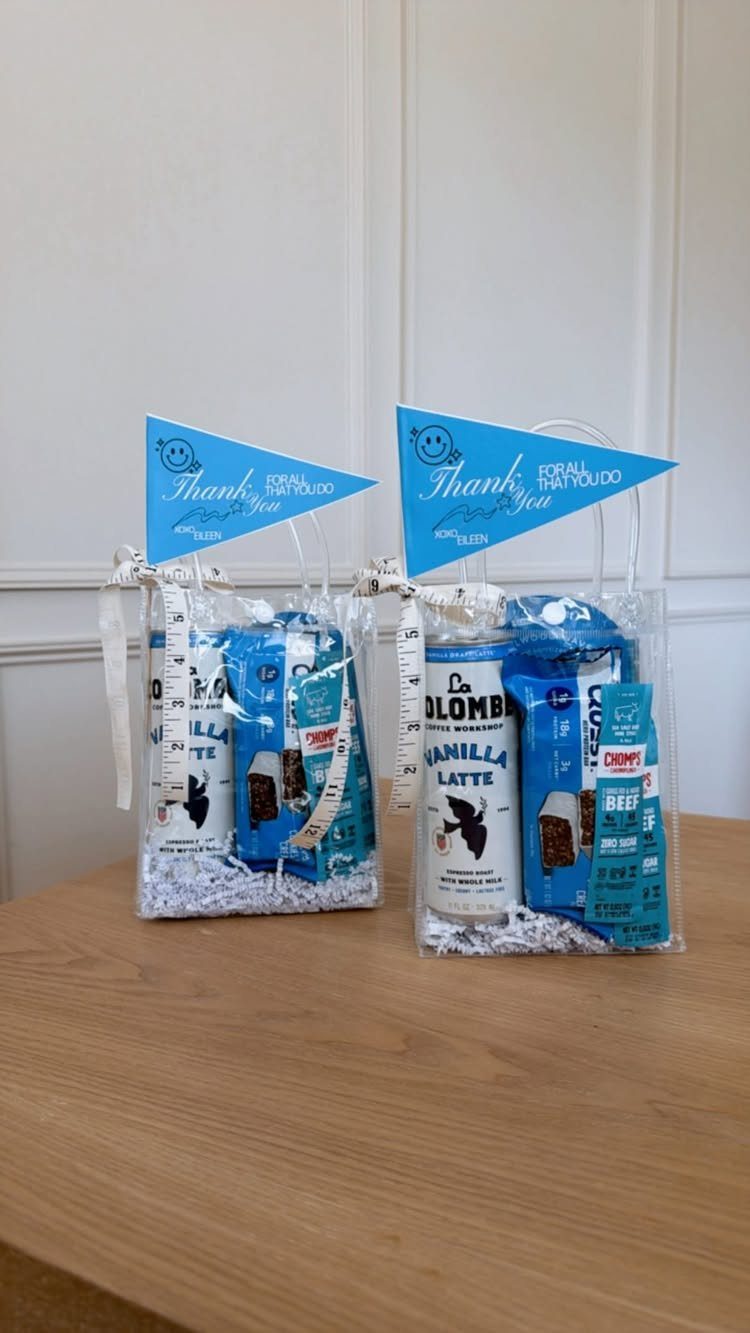 Two clear gift bags with vanilla lattes and blue snacks for teacher appreciation.