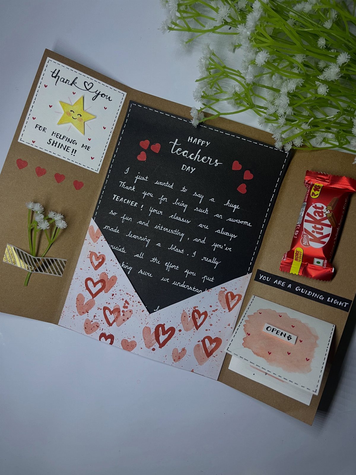 Handmade teacher appreciation card with a KitKat bar, handwritten note, and red hearts.