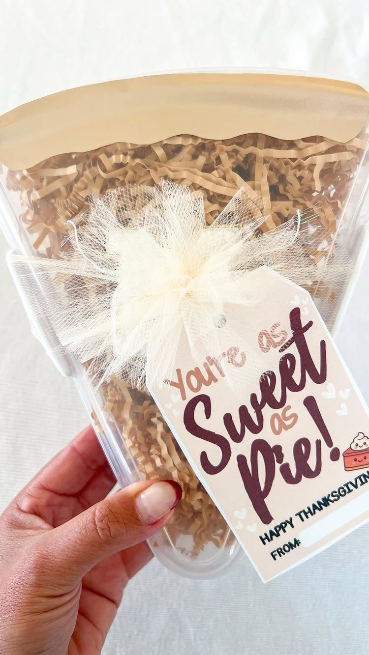 12 Thanksgiving Gifts for Coworkers They'll Actually Use 4 Gift container with brown shred and a Thanksgiving tag saying Sweet as Pie