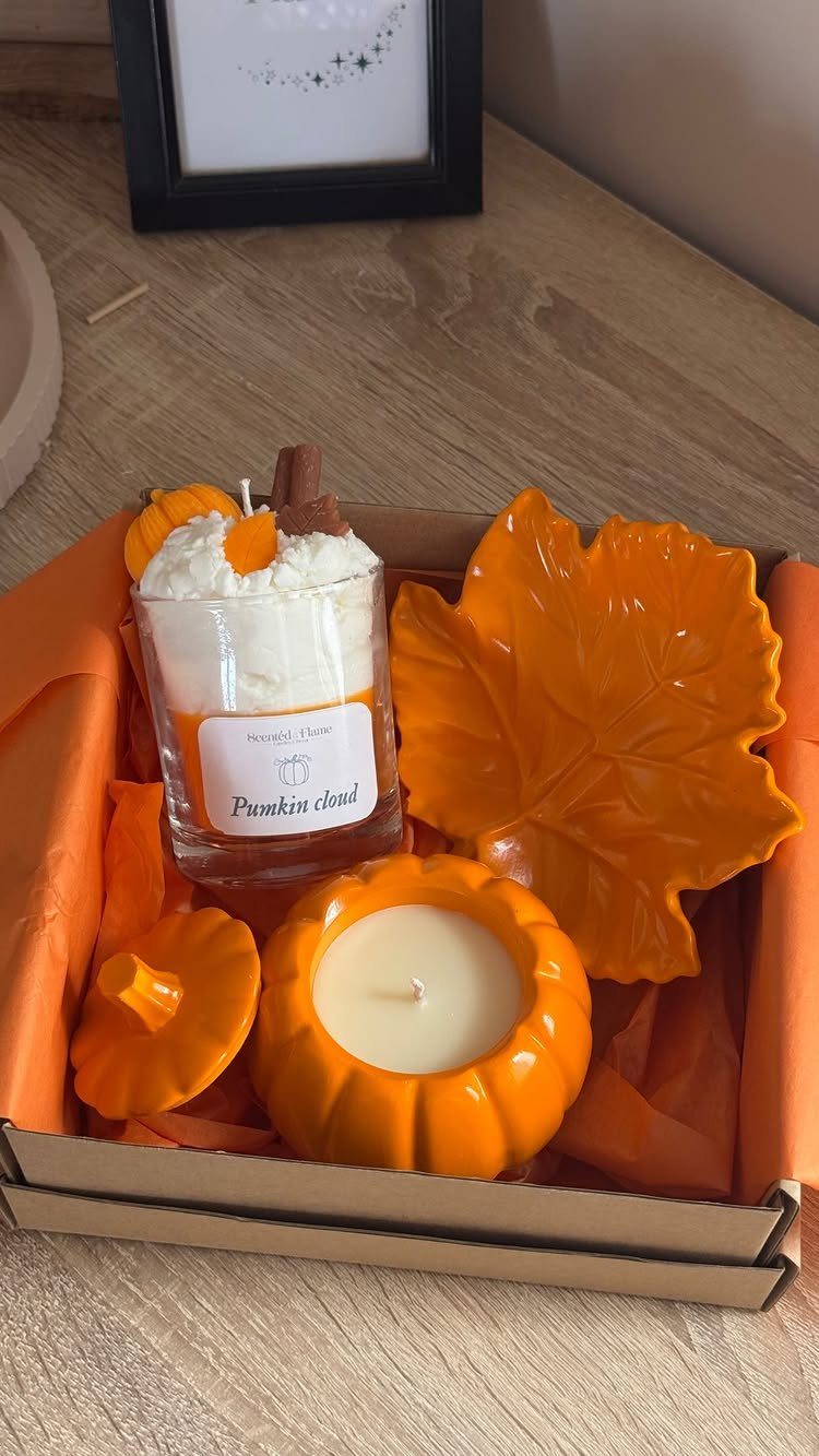 11 Thanksgiving Gifts for Family, From Candles to Cozy Throws 2 Pumpkin scented candles and an orange leaf dish in a gift box