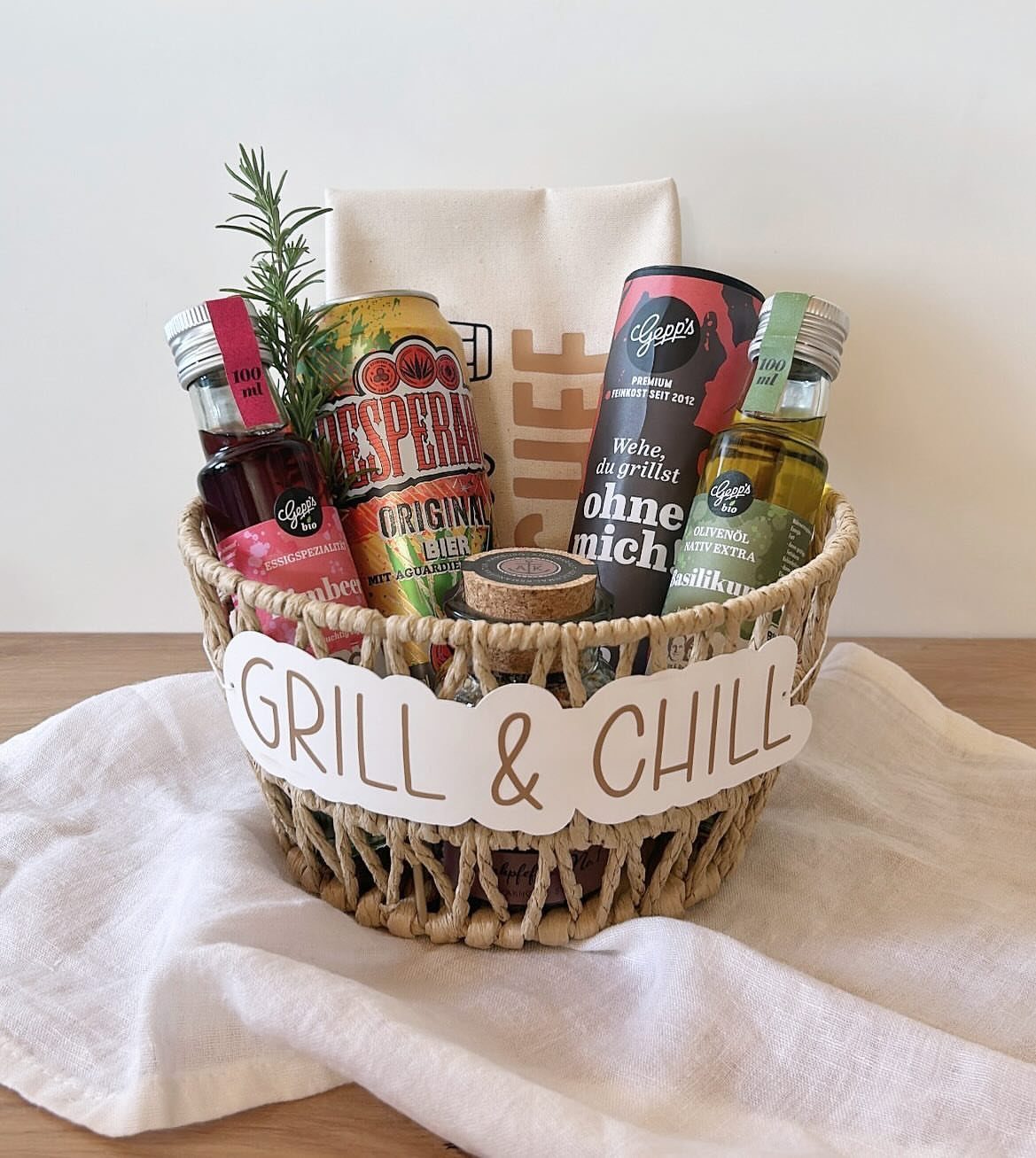 Woven gift basket with grilling sauces and a Grill & Chill sign