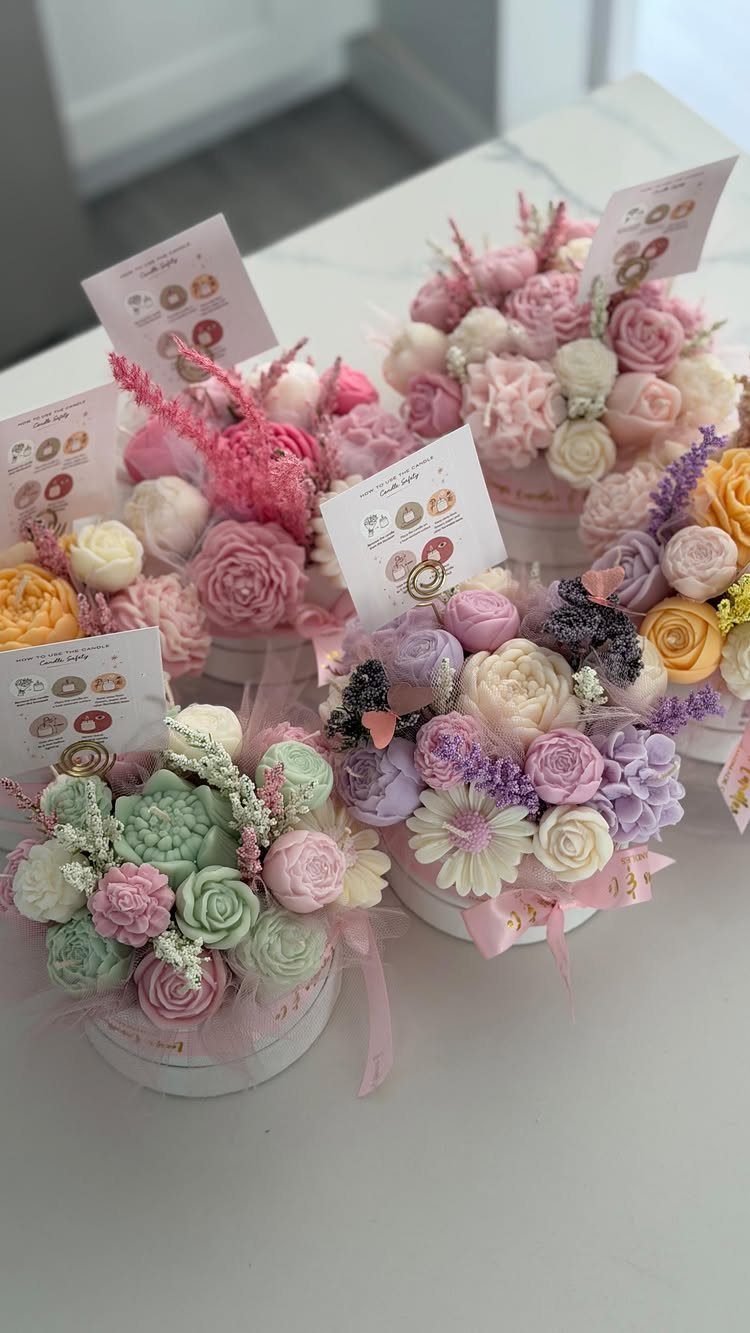 29 Trendy Gift Ideas for Her: The 2026 Gift Guide 26 Pastel buttercream frosting flowers in white gift boxes with small business cards.