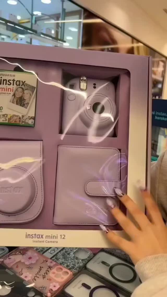 29 Trendy Gift Ideas for Her: The 2026 Gift Guide 6 Light purple Instax Mini 12 instant camera and accessories in purple packaging.