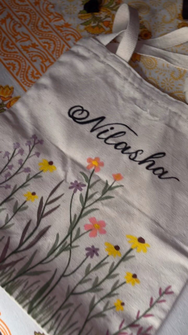 29 Trendy Gift Ideas for Her: The 2026 Gift Guide 8 Canvas tote bag with the name Nilasha and colorful floral illustrations.