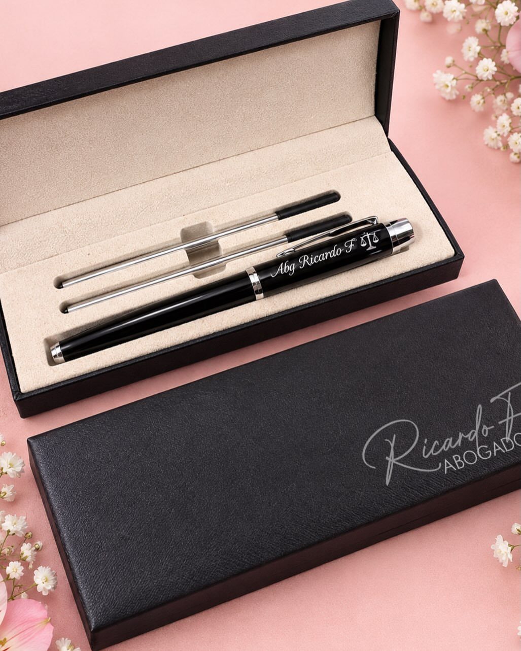 9 Unique Gift for Boss 2 Luxury pen set in a black gift box on a pink floral background