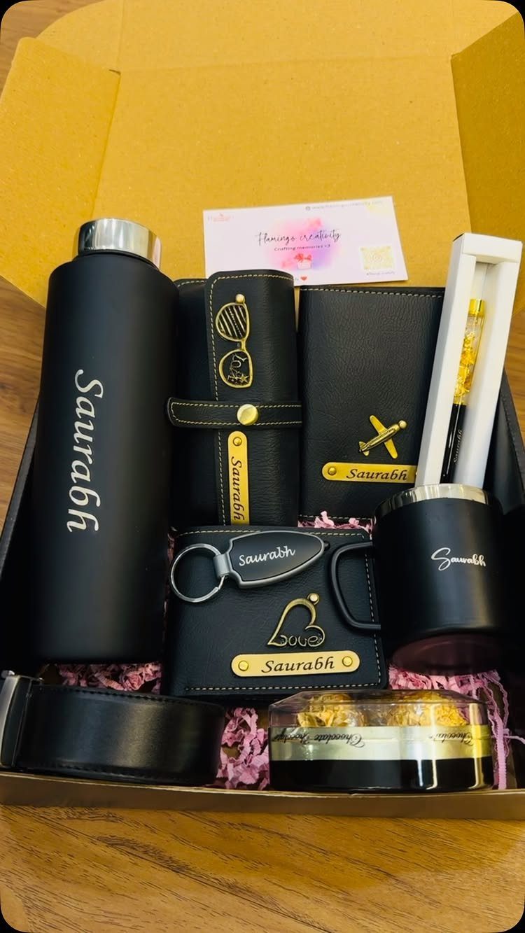 9 Unique Gift for Boss 1 Black personalized gift set with name Saurabh engraved on bottle, wallet, and tumbler.