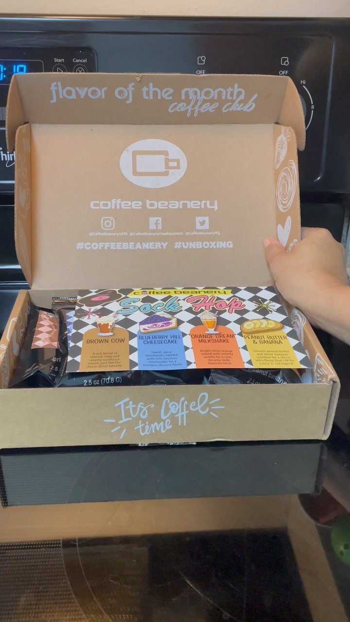 12 Useful Gifts for Dad: Practical Picks He'll Actually Use 11 Coffee subscription box containing various coffee bags and a flavor guide on a counter