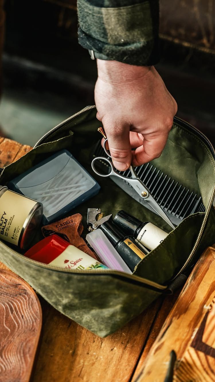 12 Useful Gifts for Dad: Practical Picks He'll Actually Use 10 Grooming kit with scissors, comb, and skincare products in a green canvas bag.
