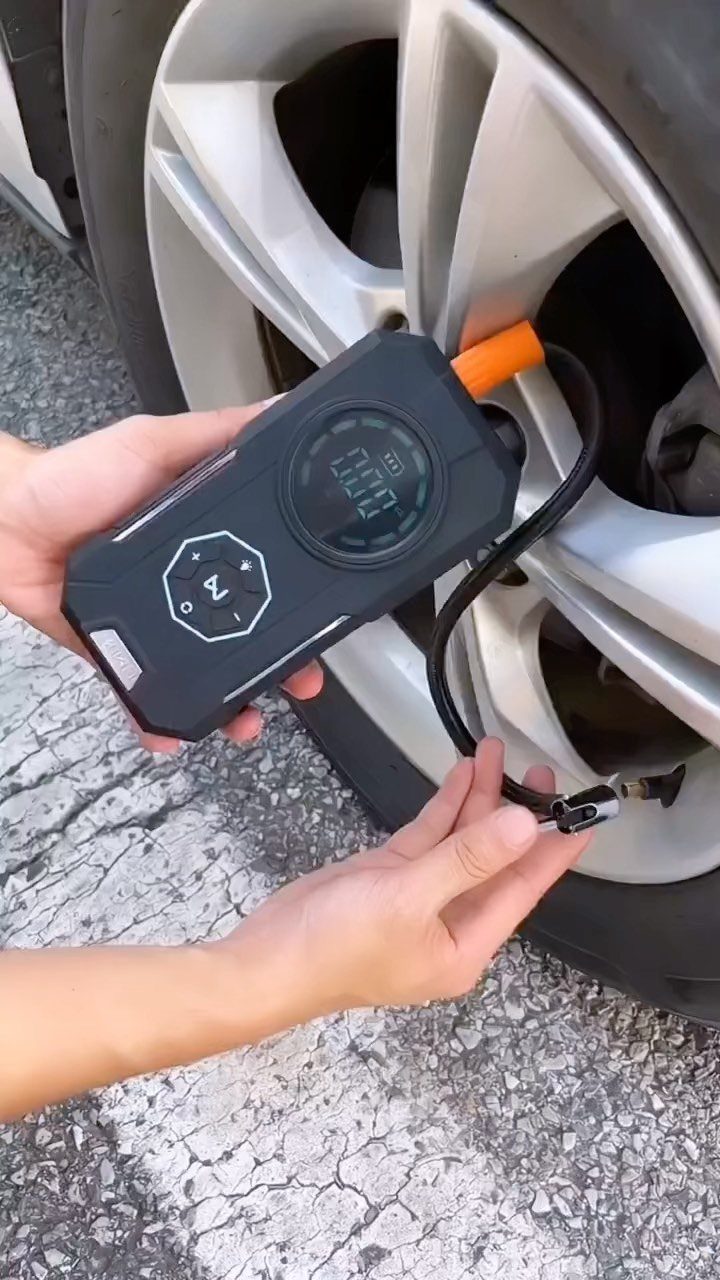 12 Useful Gifts for Dad: Practical Picks He'll Actually Use 2 Portable air compressor being used to inflate a silver car tire on pavement.